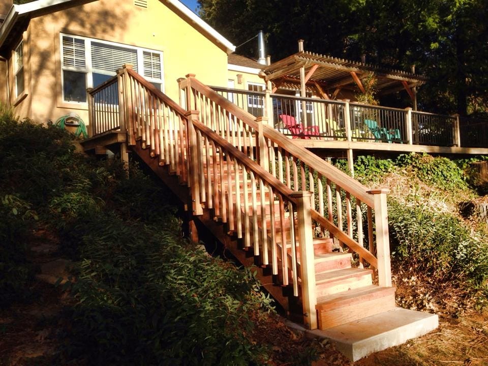 A wooden staircase leading to the top of steps.