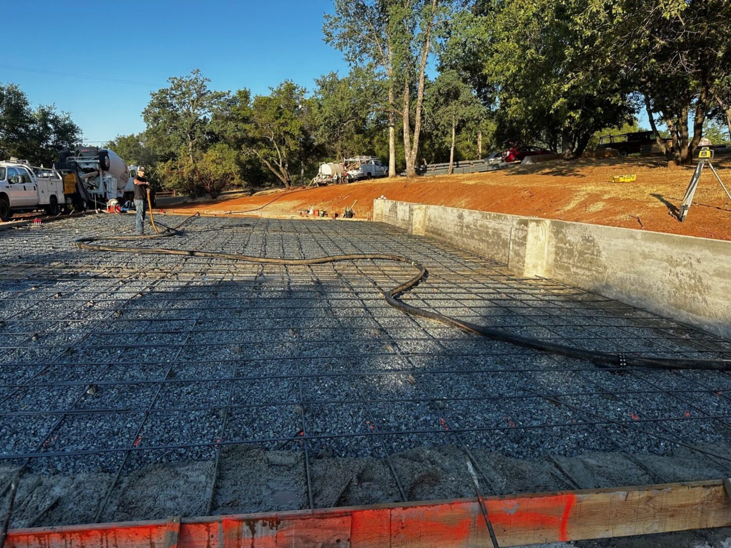 A concrete slab being poured for the construction of a house.