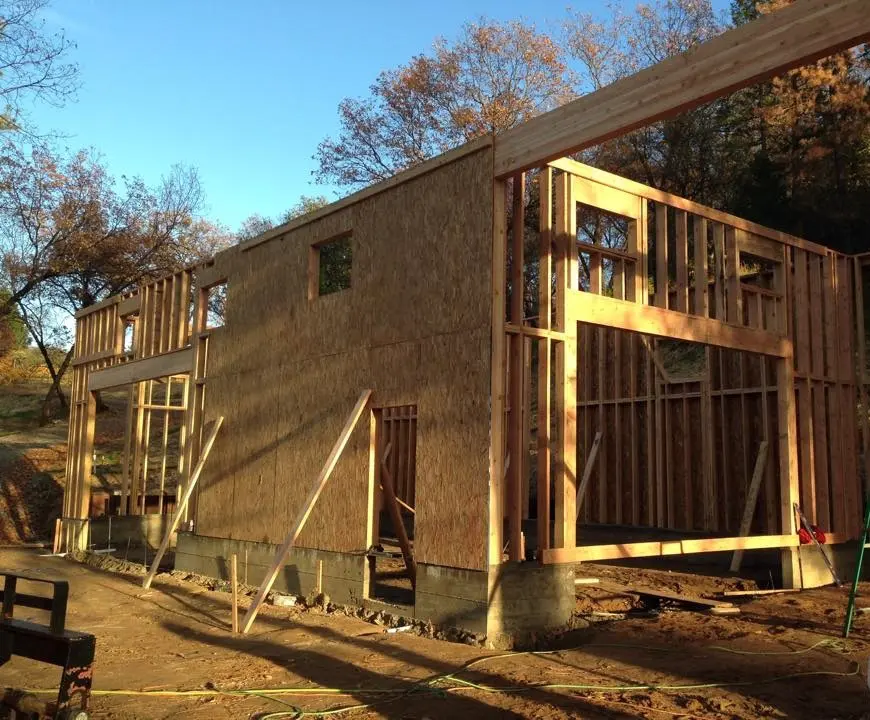 A building under construction with wood framing.