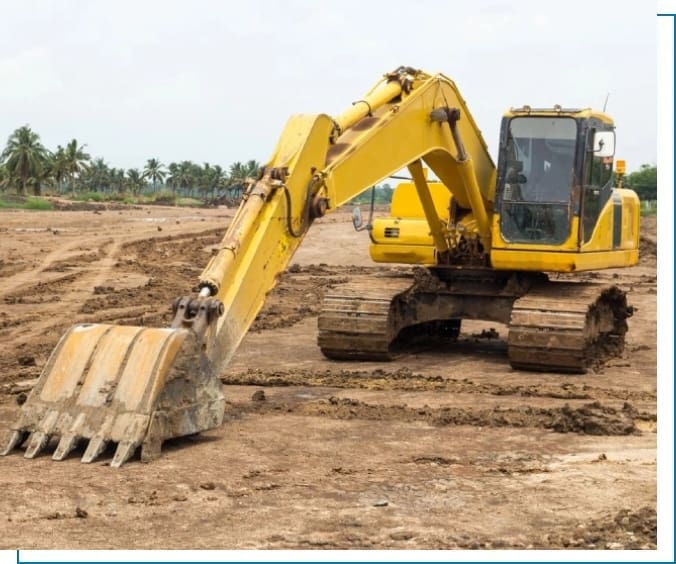 A yellow excavator is on the dirt